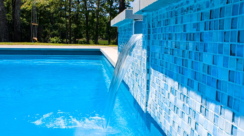 The Haven with Overflow - a freestanding spa with waterfall into fibreglass pool