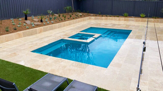 The Muse with Spa 7.60m in Shoreline A small pool with beautiful blue aquamarine colour, located in a landscaped backyard in Geelong